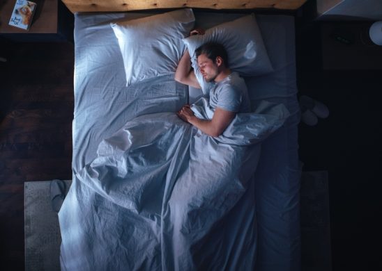 Top,View,Apartment,Bedroom:,Handsome,Young,Man,Sleeping,Cozily,On